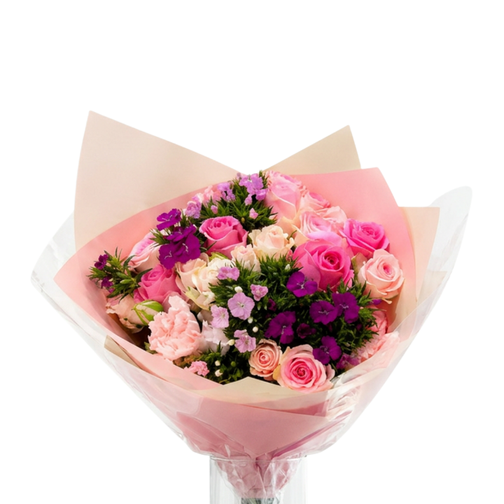 A vibrant bouquet of pink, purple, and peach roses wrapped in pink paper and clear cellophane, set against a solid white background.