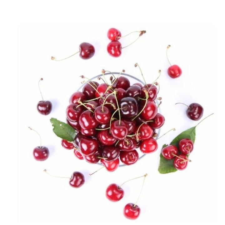 Fresh red cherries in a scattered display, from Sharbatly.