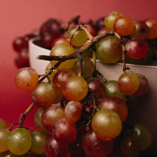Fresh mango grapes from Sharbatly in a 0.5 kg pack, showcasing ripe, juicy fruit with vibrant yellow and purple hues.