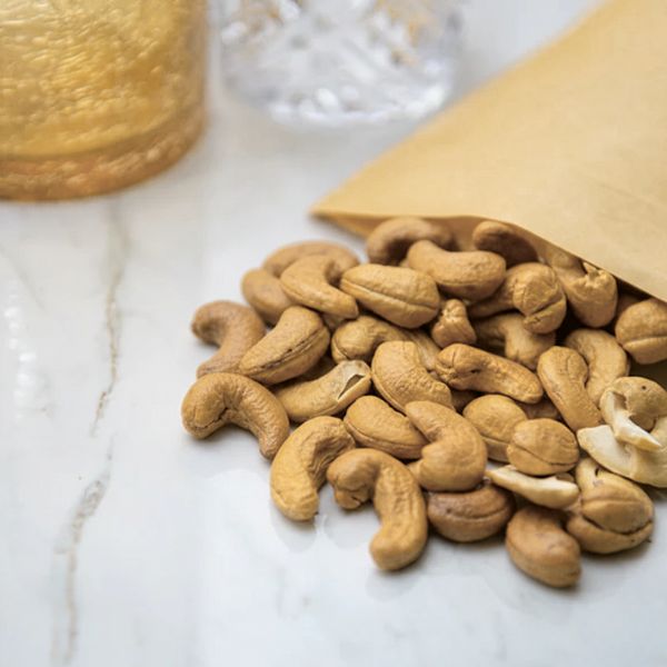 Roasted cashews from Fresh Nuts in a 0.25 kg pack, showing golden-brown, crunchy nuts on a white background.