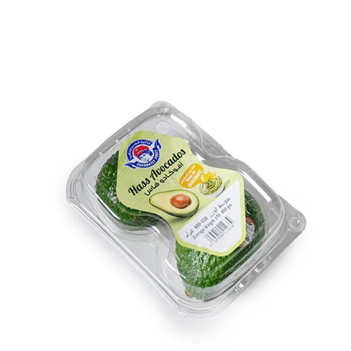 Two fresh Hass avocados from Sharbatly, premium quality, shown with smooth green skin and natural shape, ideal for home and garden use.