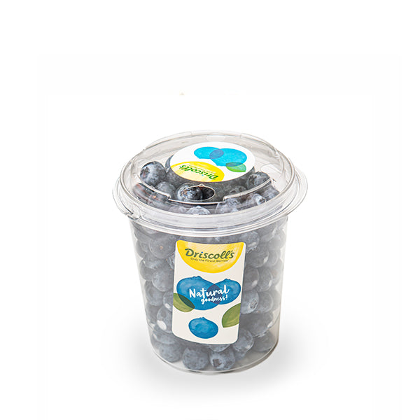 Fresh blueberries in a 0.5 kg family pack by Driscoll's, displayed in a clear, vibrant fruit container.