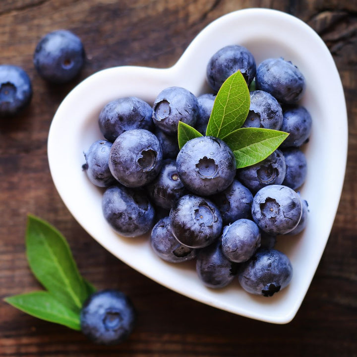 Fresh jumbo blueberries in a 0.2kg pack from Driscoll's, displayed in a clear container with vibrant blue color.