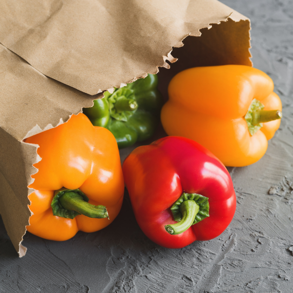 Mixed capsicum peppers in a 1 kg pack, vibrant colorful vegetables from Local Market for fresh cooking and salads.