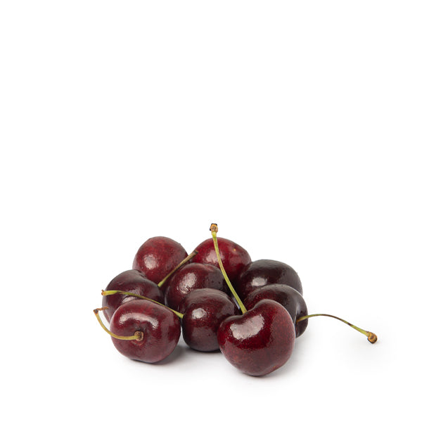 Fresh red cherries in a 2 kg Sharbatly luxury gift box, showcasing vibrant, ripe fruit arranged inside a decorative box.