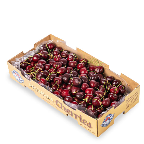 Two kilograms of fresh, bright red cherries from Sharbatly in a luxury gift box, perfect for gifting or snacking.