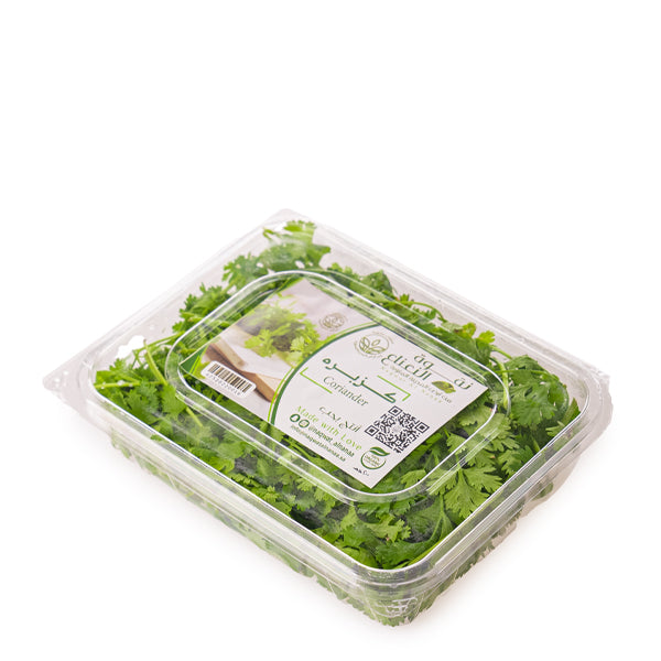 Organic coriander herb in a 0.13 kg pack by Naqwat Al Nana, fresh green coriander with leaves and stems.