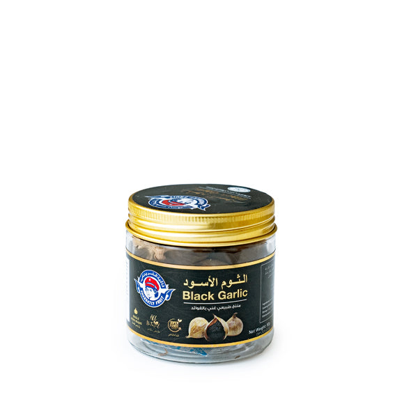 Black garlic in a 0.05kg pot from Sharbatly, showcasing glossy black cloves and fresh vegetable appearance.