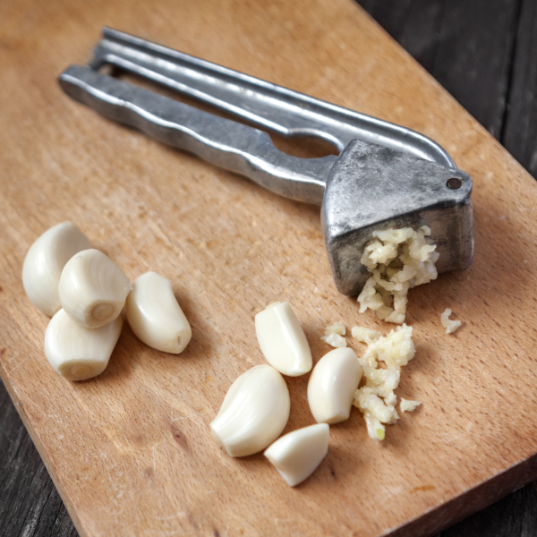 Peeled garlic cloves in a 0.15 kg pack from Sharbatly, fresh vegetable with smooth, white garlic pieces ready for cooking.