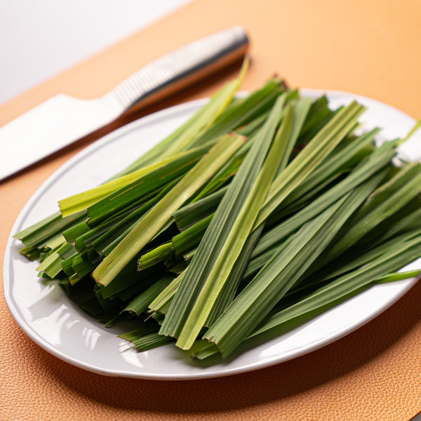 Organic lemon grass leaves in a 0.15 kg pack by Naqwat Al Nana, fresh herb with vibrant green leaves.