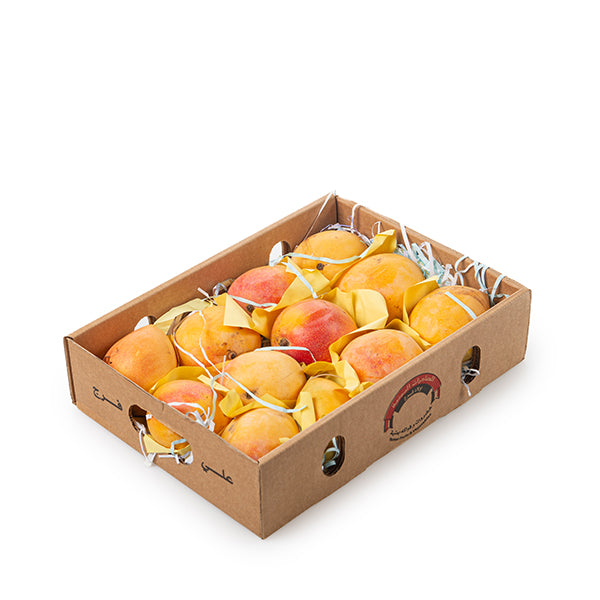 Fresh Zebda mangoes in a 3 kg carton from Sharbatly, showcasing ripe, bright orange tropical fruit ready to eat.