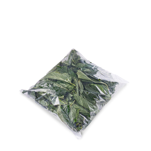 Fresh local market Molokhia leaves in a 0.25 kg pack, vibrant green vegetable perfect for traditional dishes.