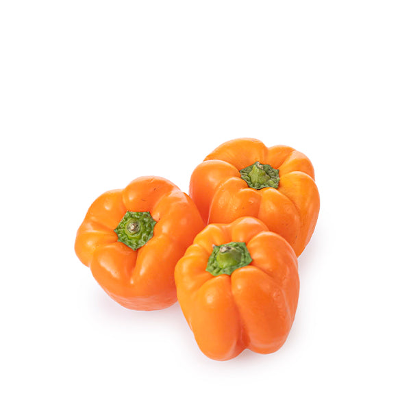 Fresh orange capsicum peppers from Local Market displayed in a 1 kg pack, showcasing vibrant color and crisp texture.