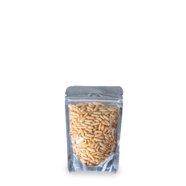 All-natural pine nuts in a 0.1 kg pack from Fresh Nuts, showing a close-up of the small, cream-colored edible seeds.