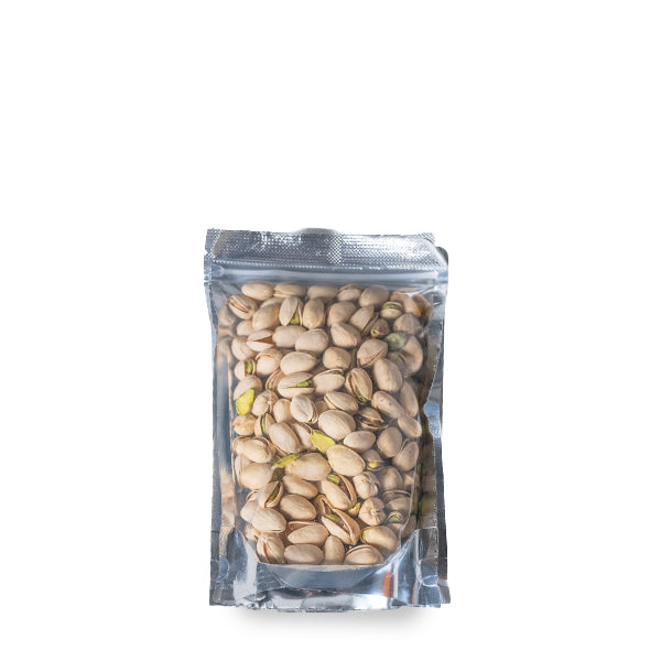 Roasted pistachios in a 0.25 kg pack from Fresh Nuts, showing green and tan nuts in a natural open container.