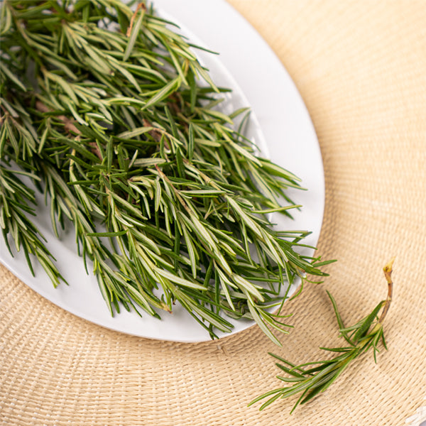 Organic rosemary herb in a 0.15 kg pack from Naqwat Al Nana, fresh green sprigs with textured leaves.