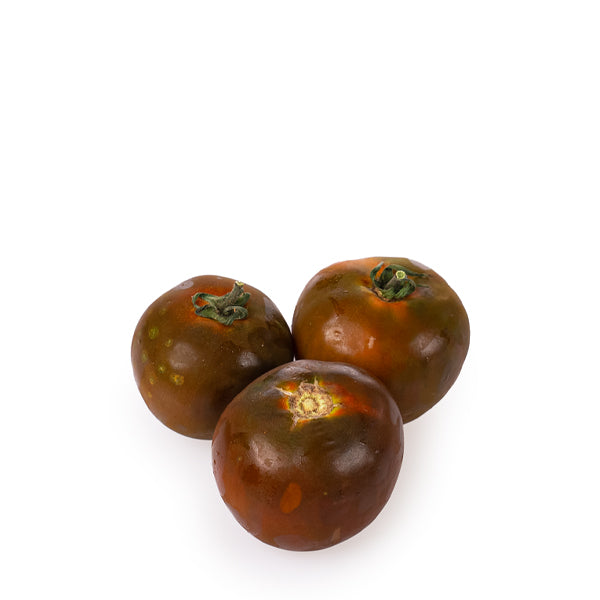 Fresh Kumato tomatoes in a 1 kg pack from Groots, showcasing ripe, glossy vegetables perfect for salads and cooking.