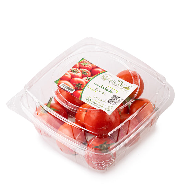Organic round tomatoes from Naqwat Al Nana, 1 kg pack, fresh and ripe vegetables with vibrant red color.