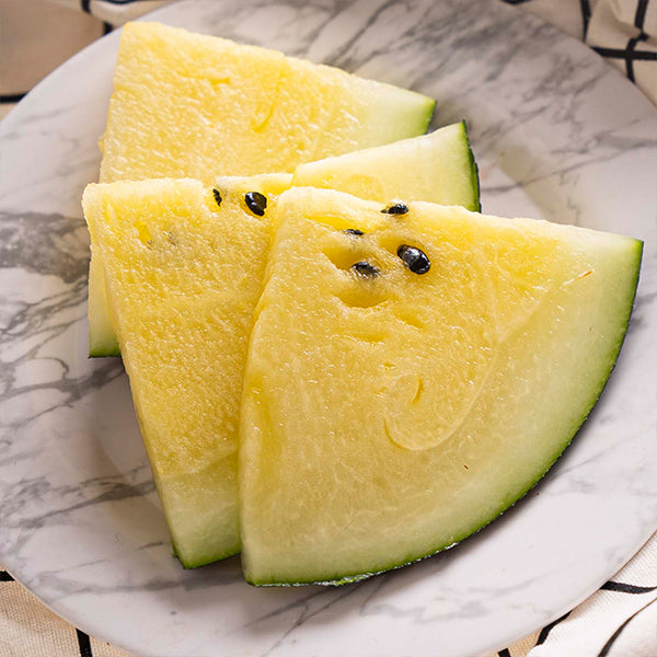 Fresh yellow watermelon baby fruit from Local Market, showcasing vibrant yellow flesh and smooth outer rind.