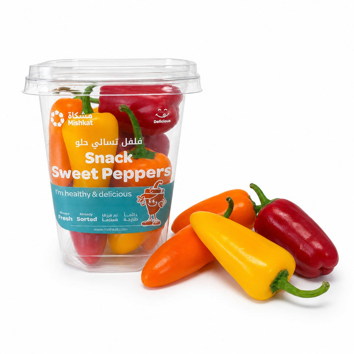 Mixed baby sweet peppers displayed beside their retail pack, from Sharbatly.