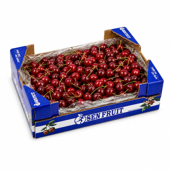 Red cherries packed in a 5 kg fruit carton, from Sharbatly.