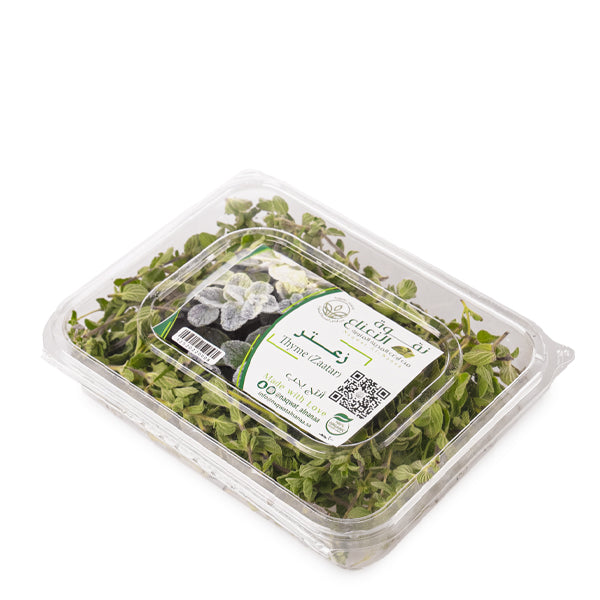 Organic wild thyme and zaatar herb blend from Naqwat Al Nana in a 0.15 kg pack, shown in a close-up of the herb mixture.