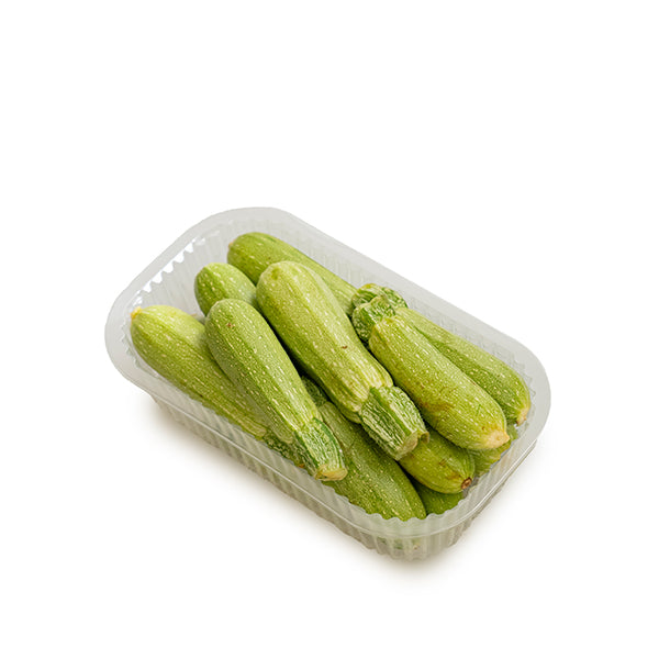 Fresh green zucchini or courgette from Local Market, 1 kg pack, showing vibrant, smooth-skinned vegetable on a white background.