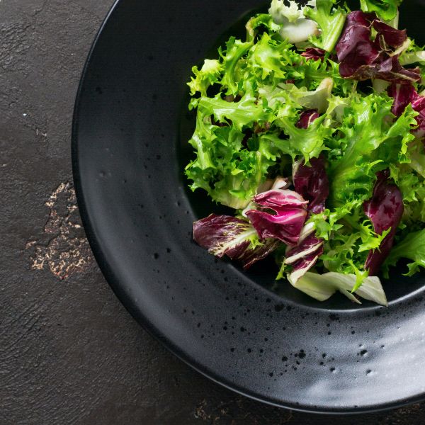 Fresh Radicchio Rosso Chioggia lettuce from Holland, single leafy vegetable with vibrant red and white leaves, ideal for salads.