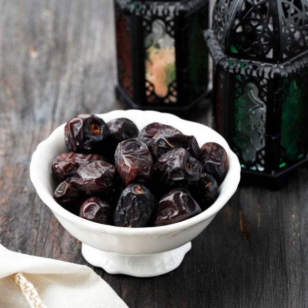 Sharbatly Ajwah dates in a 0.5 kg pack, showing fresh, dark brown date fruits with textured skin.
