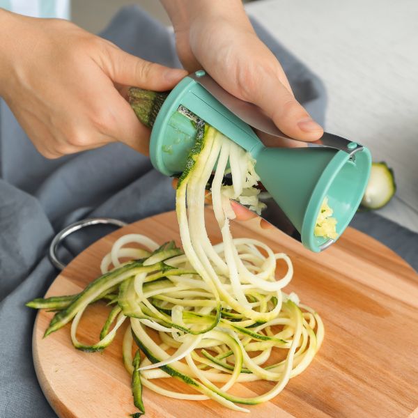 Fresh green organic zucchini from Naqwat Al Nana, 0.75 kg pack, shown with vibrant green skin and natural texture.