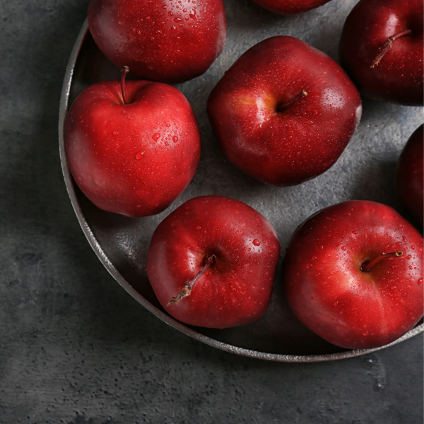 Red Delicious apples from Sharbatly in a 1 kg pack, fresh and vibrant with shiny red skin and crisp appearance.