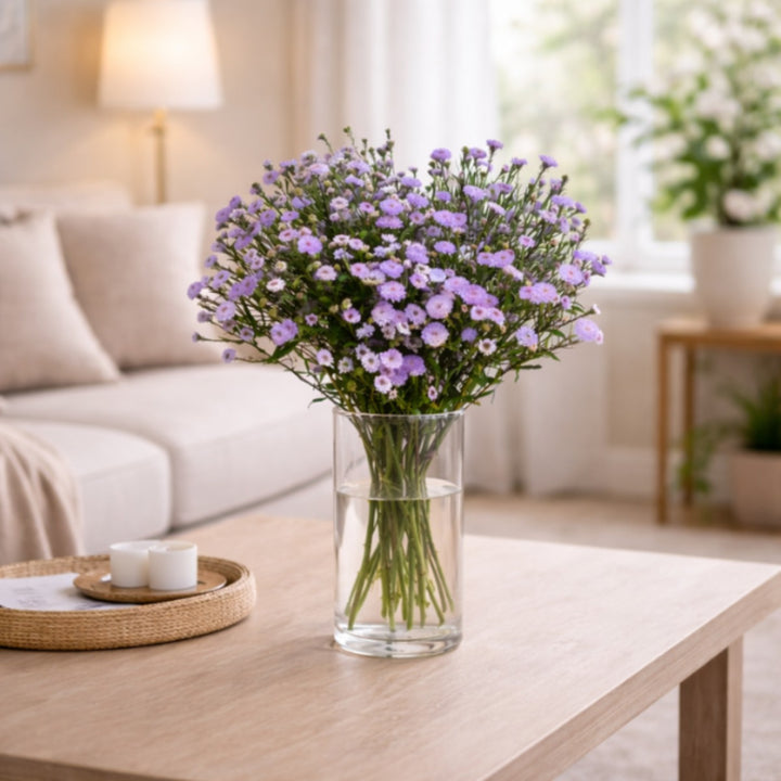 Light purple Aster flower stems from SQ Flora Kenya, showcasing 10 vibrant blooms arranged in a natural bouquet.