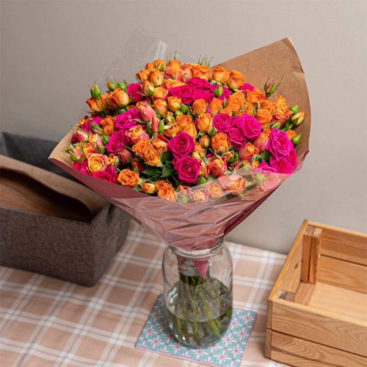 Sunset luxury bouquet of 30 baby roses from Mix Flower Bouquet, featuring vibrant pink and orange blooms arranged beautifully.