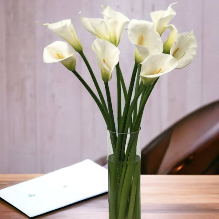 Fresh Flower Holland Calla Lily bouquet with 10 Crystal Blush Zantedeschia stems, showcasing elegant, pink flowers on a white background.