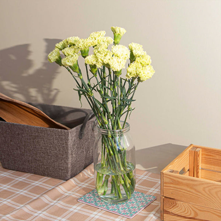 19 green carnations with vibrant blooms arranged in a bouquet from SQ Flora Kenya, showcasing fresh, colorful flowers.