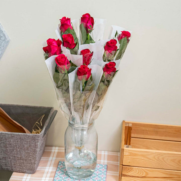 Cerise pink rose flower from SQ Flora Kenya with a single stem, individually wrapped for freshness and presentation.