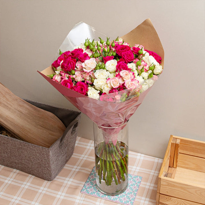 Cerise pink luxury flower bouquet with 30 stems of mixed flowers, arranged in a elegant bouquet style.