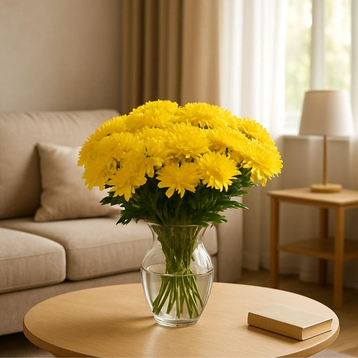 Yellow chrysanthemums flower stems from Black Tulip, showing vibrant blooms and green foliage on multiple stems.
