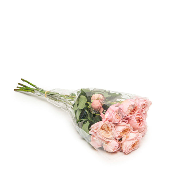 Bouquet of 5 stems of Spray Rose Jullietaa flowers from SQ Flora Kenya, showcasing vibrant pink blossoms in a garden setting.