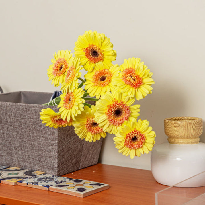 Bright yellow Gerbera flowers from Flowranow, featuring 10 stems of the Novelty Febe variety displayed in a bouquet.