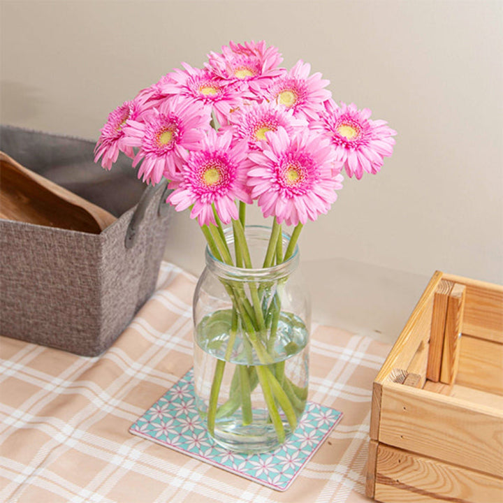 Bright pink Mini Bergomi Gerbera flowers from Black Tulip, arranged in a bouquet with 10 stems.