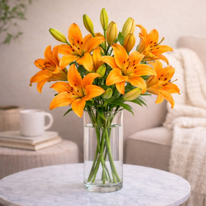 Fresh Asiatic Cortona Orange lilies with five stems, vibrant orange flowers from Dutch flower supplier, perfect for floral arrangements.