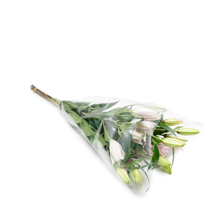 Bouquet of five scented Oriental Lilies with double petals from SQ Flora Kenya, arranged in a natural floral display.