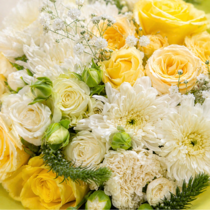 Mixed yellowish bouquet with 15 stems of assorted flowers from Black Tulip, showcasing a vibrant, natural floral arrangement.