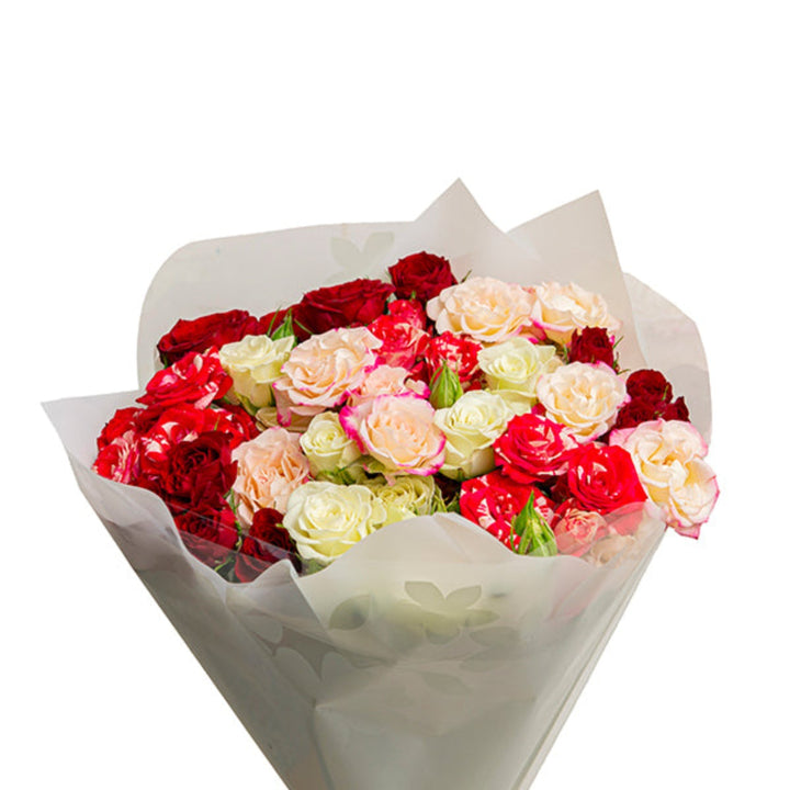 Pink Whisper Bouquet with 12 stems of mixed pink flowers, showcasing vibrant blooms and lush greenery in a floral bouquet.