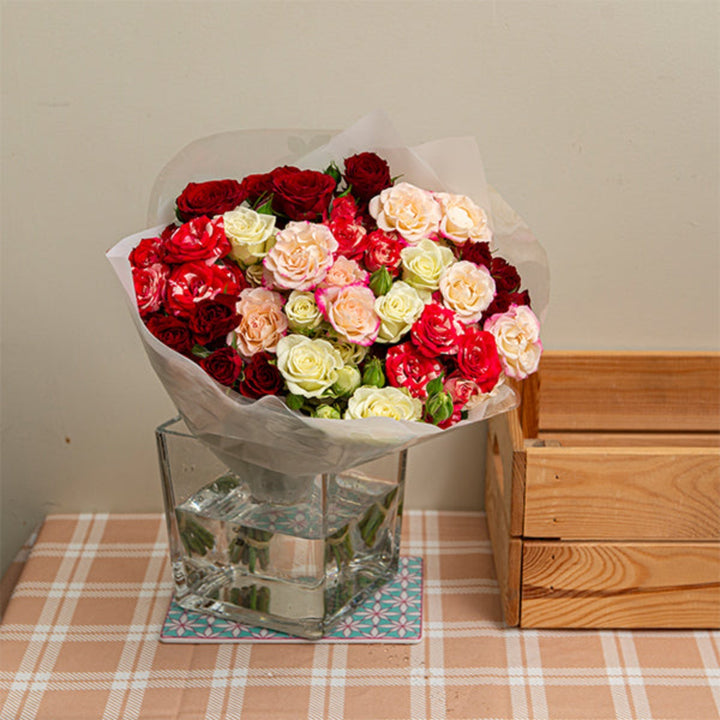 Pink Whisper Bouquet with 12 stems featuring pink and white mixed flowers, arranged in a beautiful floral bouquet by Mix Flower Bouquet.