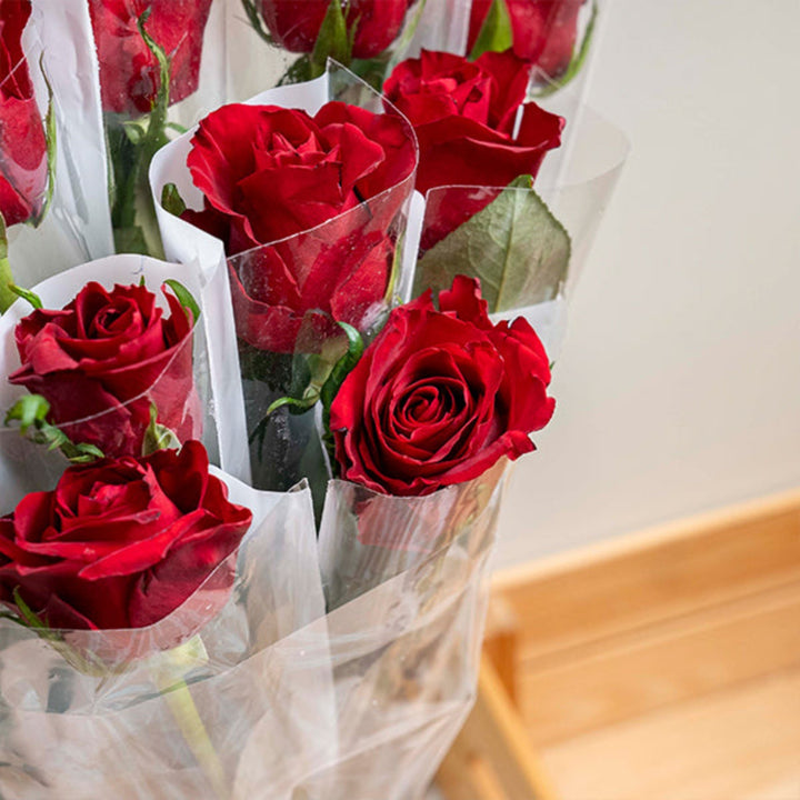Red rose flower from SQ Flora Kenya, single stem, individually wrapped, fresh and vibrant floral bloom.