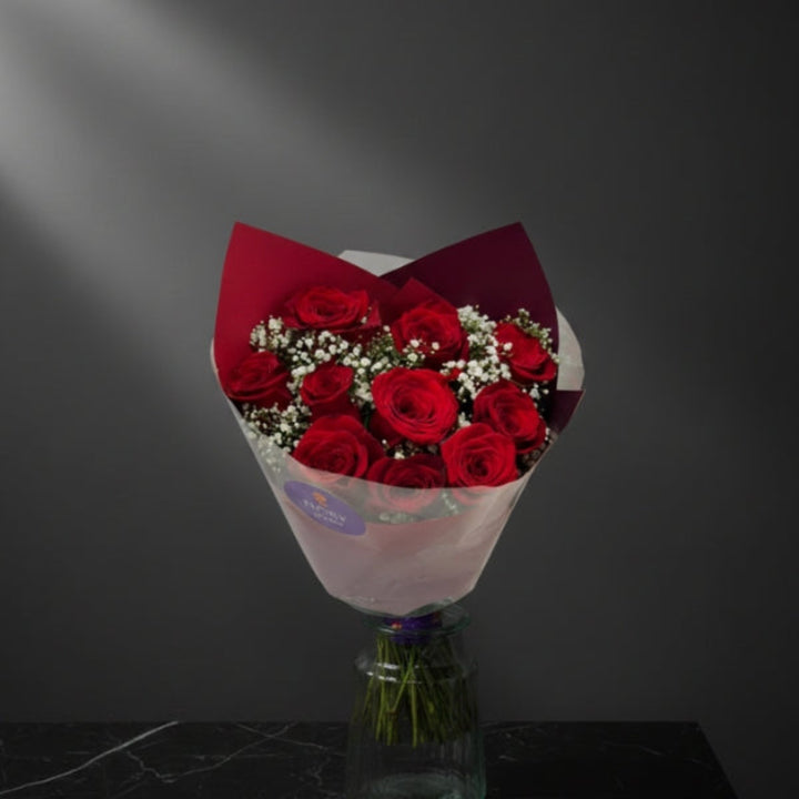 Red Roses Classic Bouquet with 12 stems in a Mix Flower Bouquet, showcasing vibrant red roses arranged in a lush floral display.