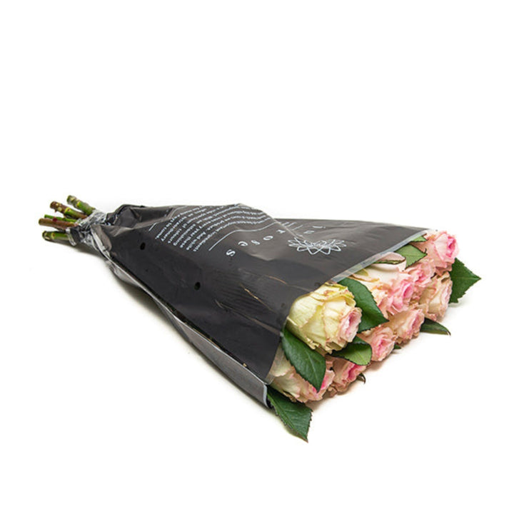 Pink scented Joyce rose flowers, 8 stems, arranged with lush green leaves, from Vegpro Kenya.