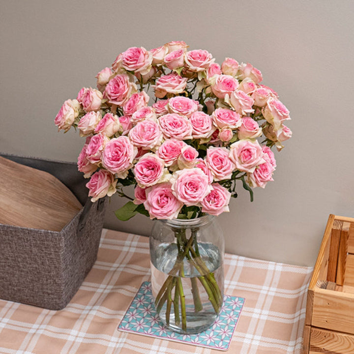 Bouquet of 10 pink Roses Baby flowers by Black Tulip, with delicate blooms and lush green stems.
